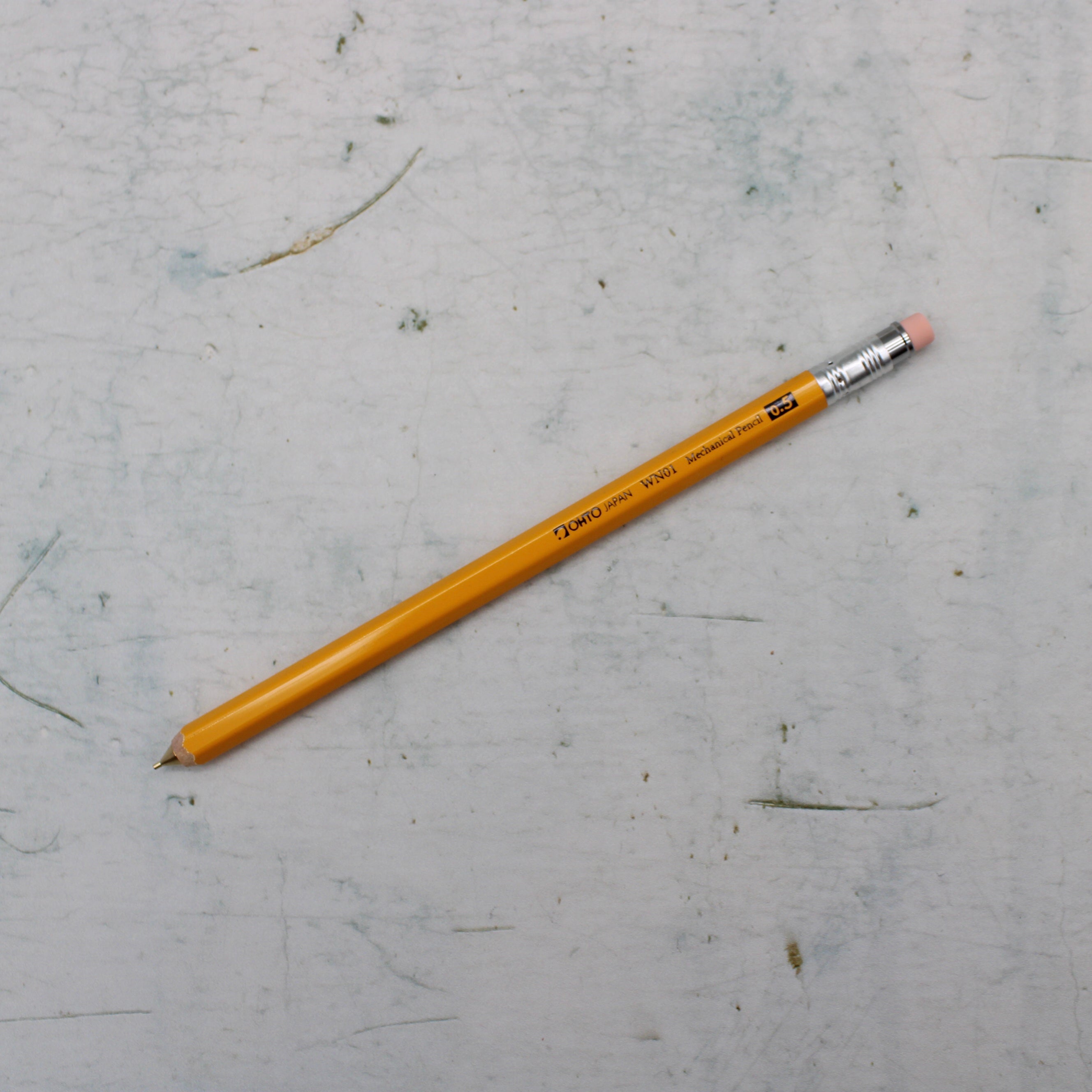A yellow wooden mechanical pencil from the Pencil Me In stationery shop. 