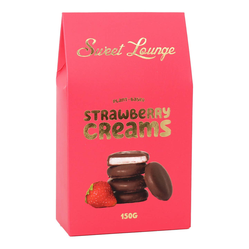 A bright pink stand-up pouch of Sweet Lounge Strawberry Creams, featuring gold foil lettering and an illustration of chocolate-covered strawberry creams and a strawberry on the front, set against a plain white background.
