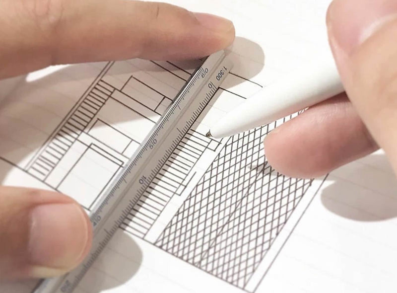 An image demonstrating how to use a drafting scale from the Pencil Me In stationery shop. 
